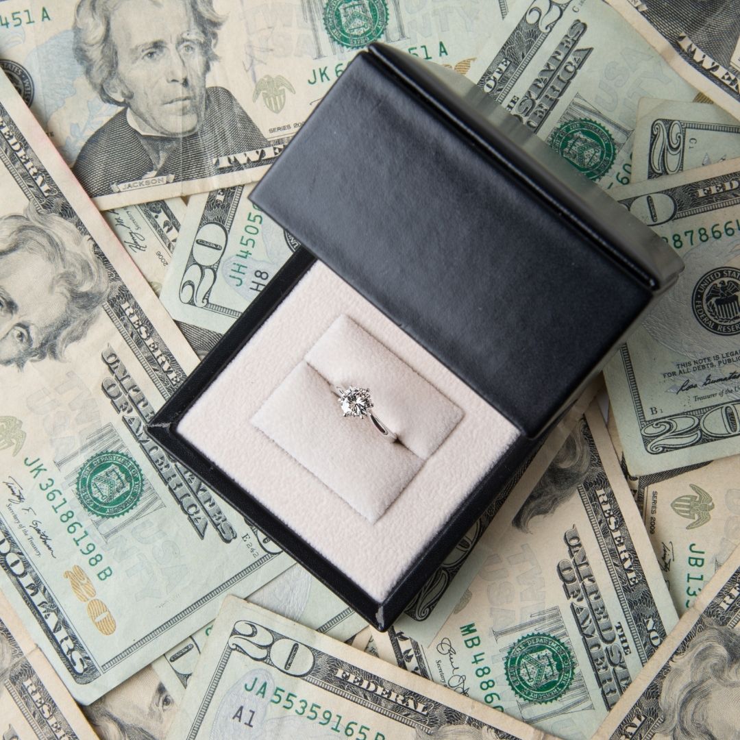 a ring on a pile of money